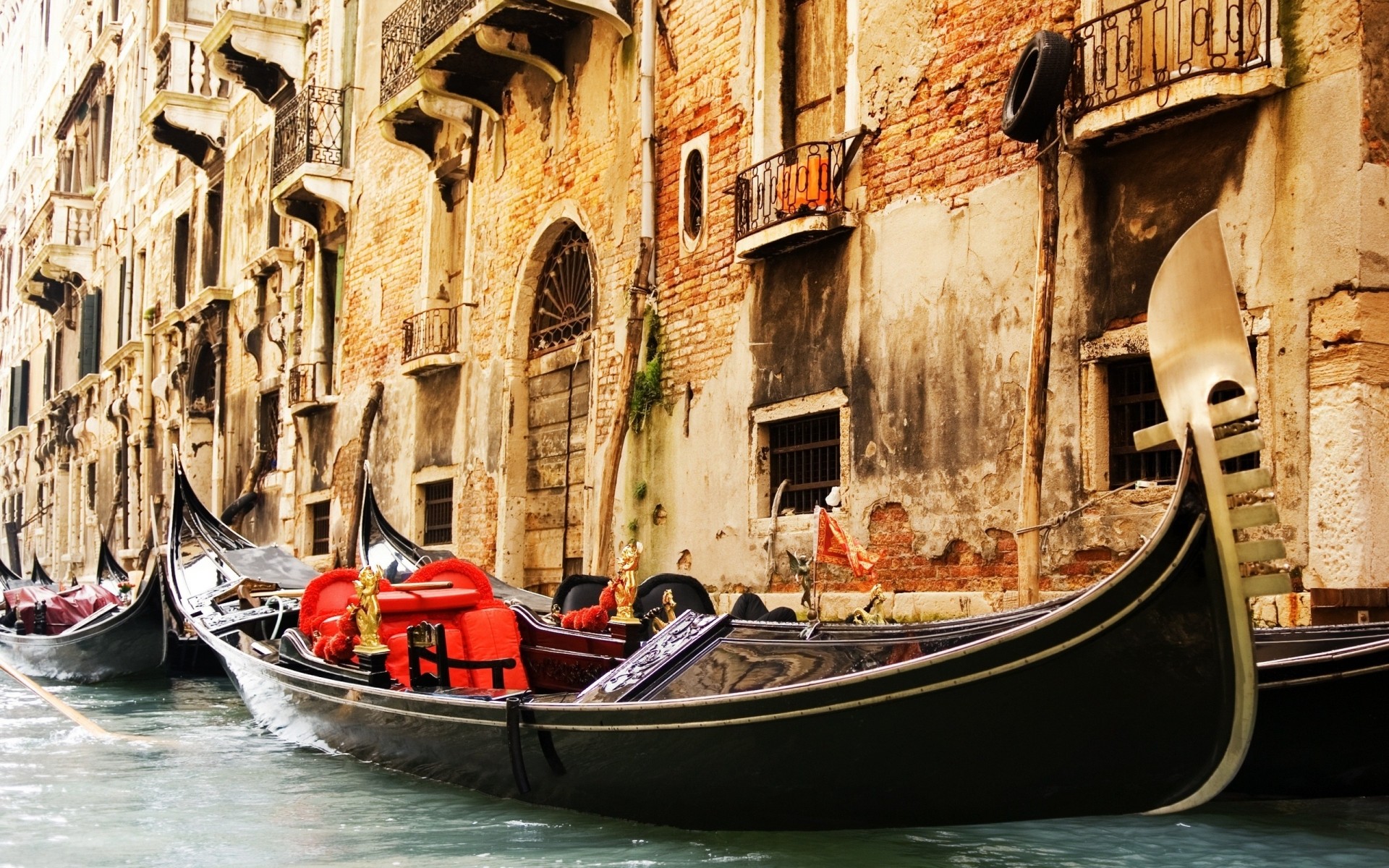 italy gondola venetian canal gondolier boat travel tourism old water city town transmit traditional transportation system architecture building tourist vacation street world