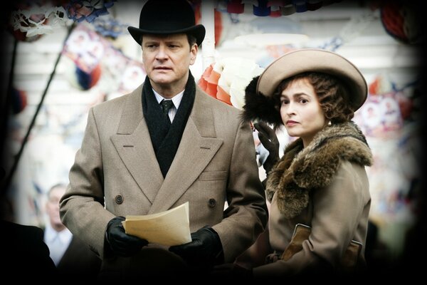 Colin Firth in the movie The King Speaks . A man and a woman from the last century.