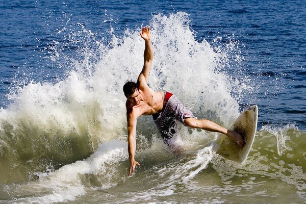 Surfing in the raging ocean