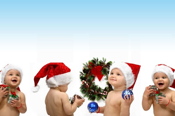 Cute kids in Santa Claus s arms