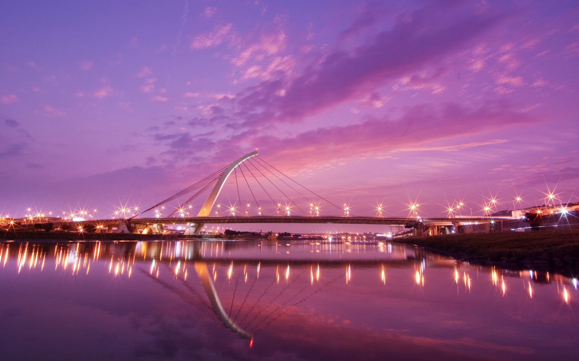 other city bridge dusk water sunset city evening river travel sky architecture reflection transportation system urban building cityscape dawn skyline clouds taiwan