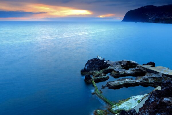 Blue ocean at sunset in autumn