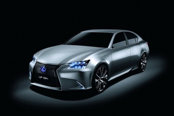 Lexus with blue headlights is in the dark