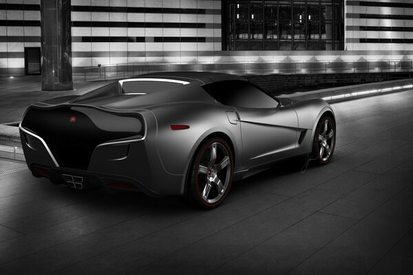 Grey supercar on a city landscape background