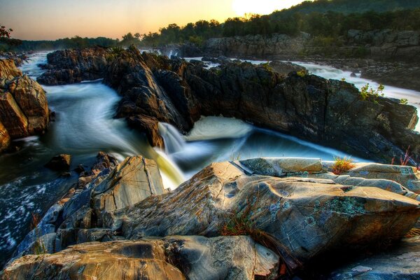 Landscape with rocky rapids and waterfalls