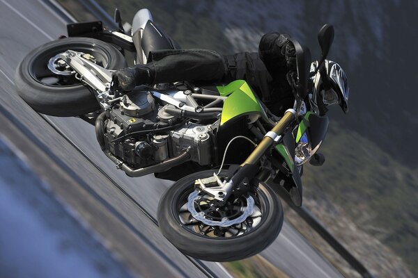 The motocyclist flies up in the air