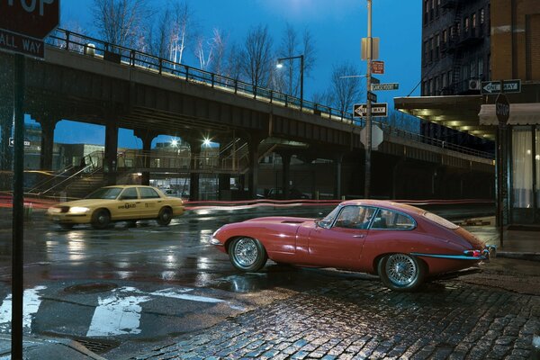 An old car in the city at the crossroads