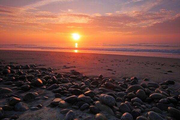 Sunset on the sea with a view from the rocks