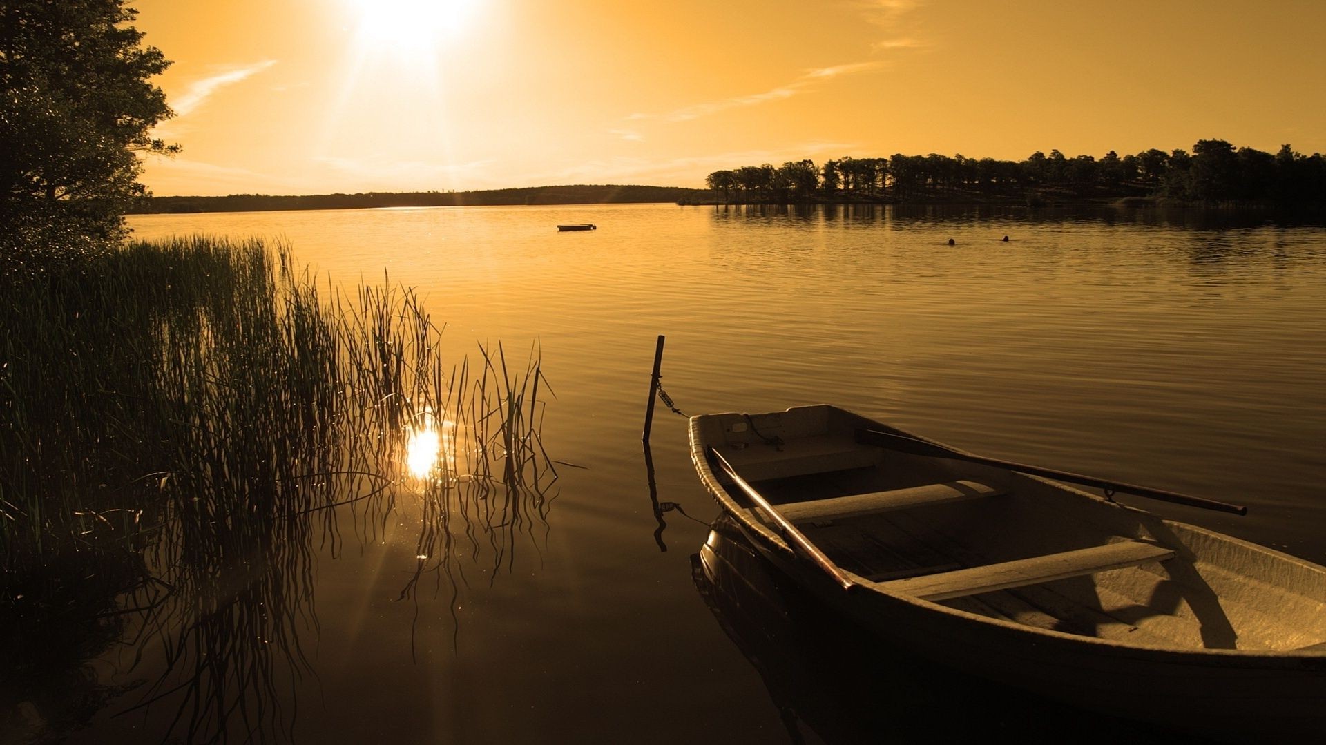 the sunset and sunrise sunset water dawn lake reflection evening dusk river sun boat beach watercraft placid canoe