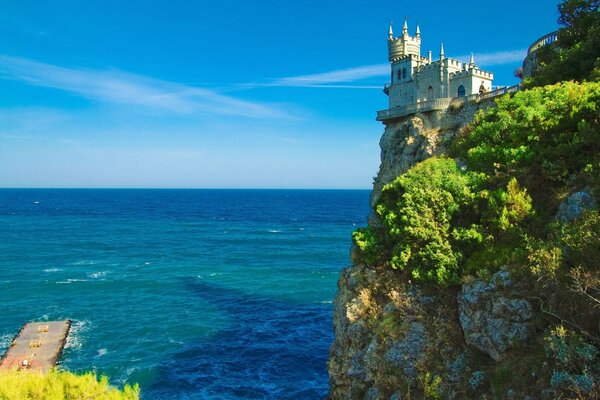 Seascape with a castle on a rock