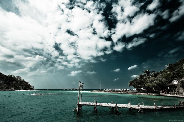 Bridge on the water , tourist beach