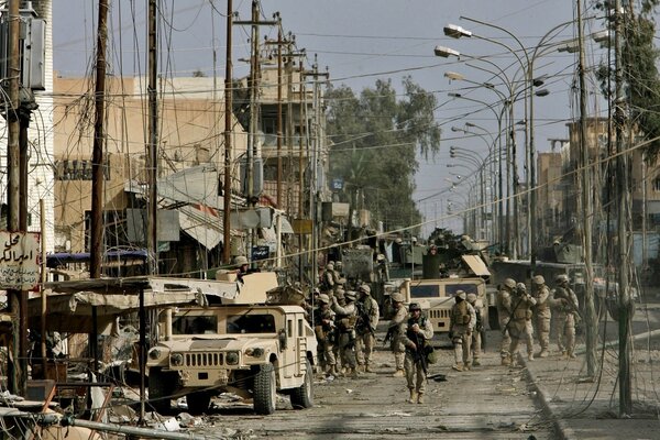 Destroyed street with NATO troops