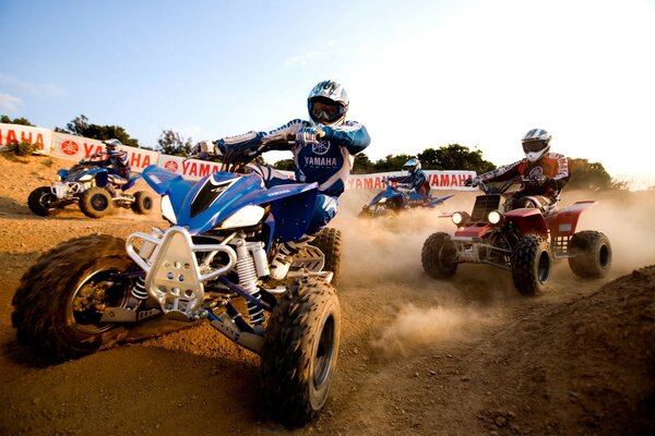 Racing on yamaha quad bikes on a dirt road