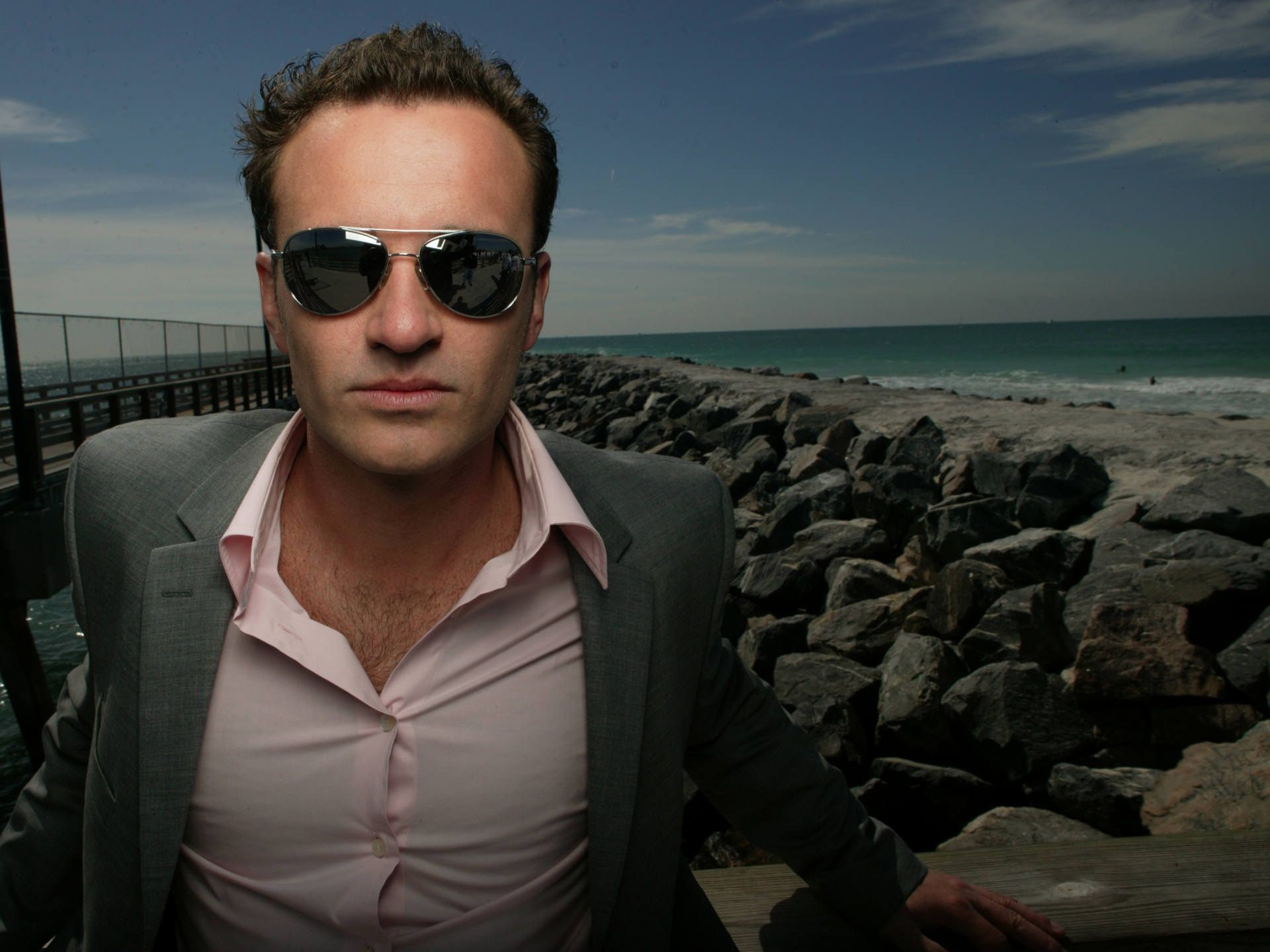 actors beach man landscape sea water sun sunglasses