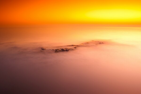 Misty dawn in orange tones