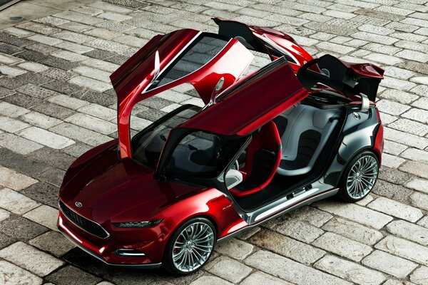 A red car with unusual doors