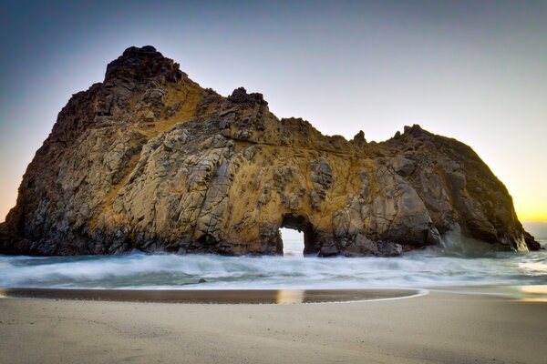 Arch in the rock on the sea