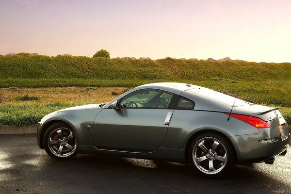 Nissan on the background of the landscape at sunset