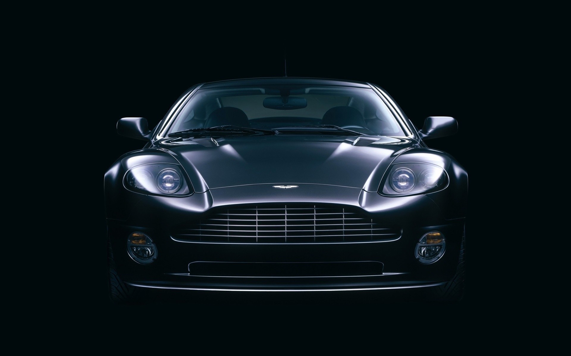 aston martin car vehicle automotive wheel coupe transportation system sedan blacktop hood pavement noon chrome