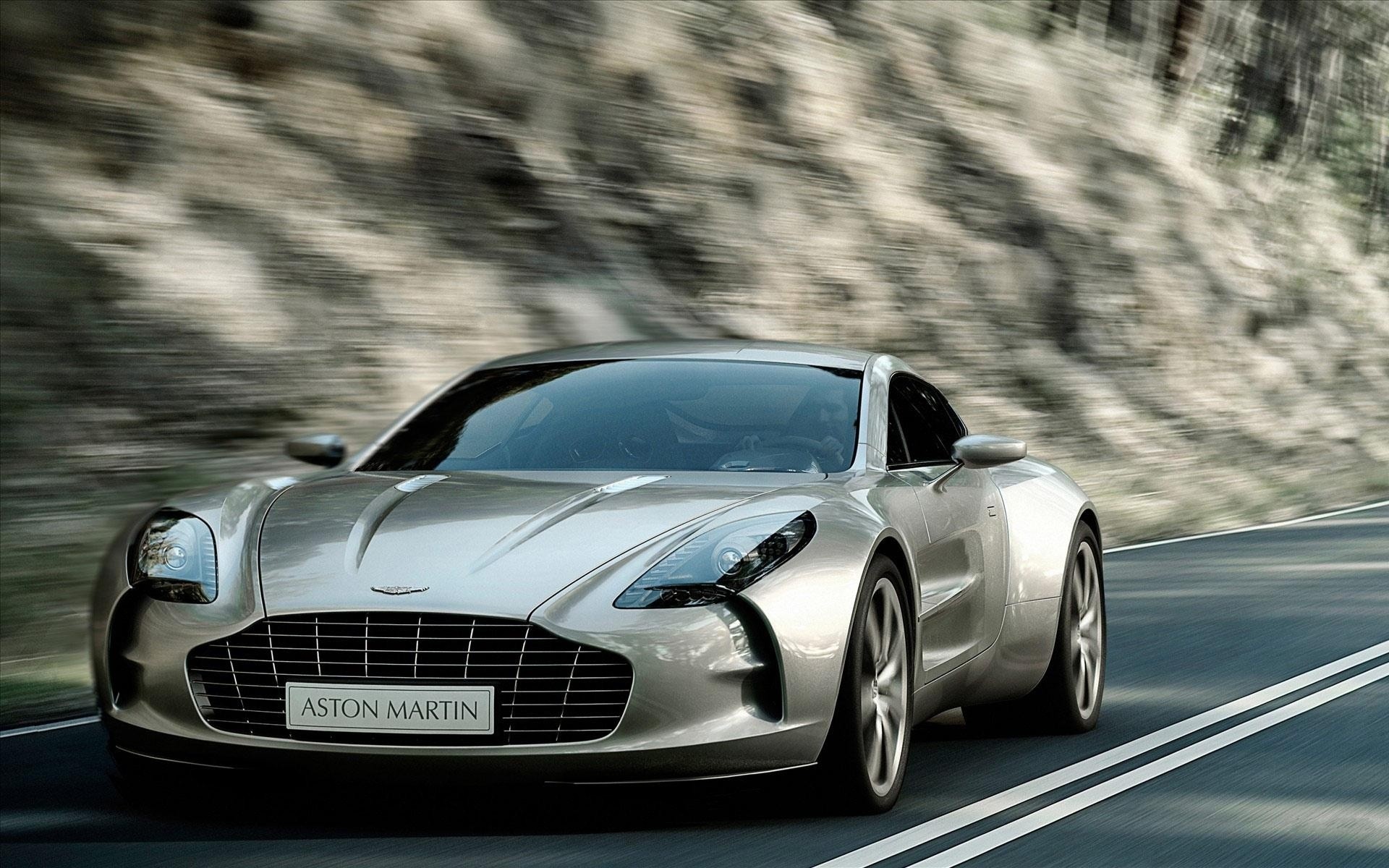 aston martin auto auto asphalt schnell beeilen sie sich fahren schwarz automobil pflaster transportsystem räder aktion coupé rennen aston martin coupé