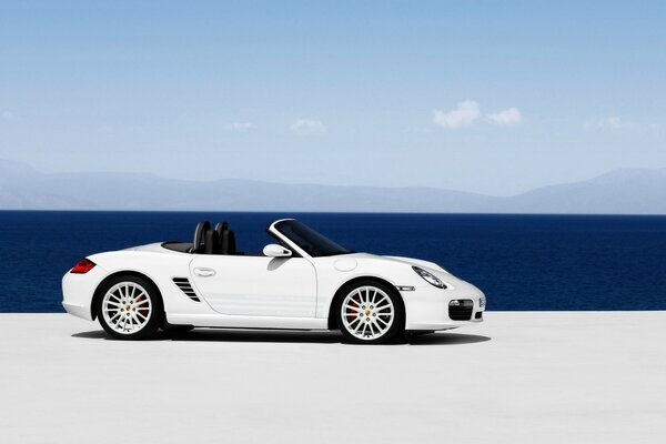 White Porsche on the background of the sea