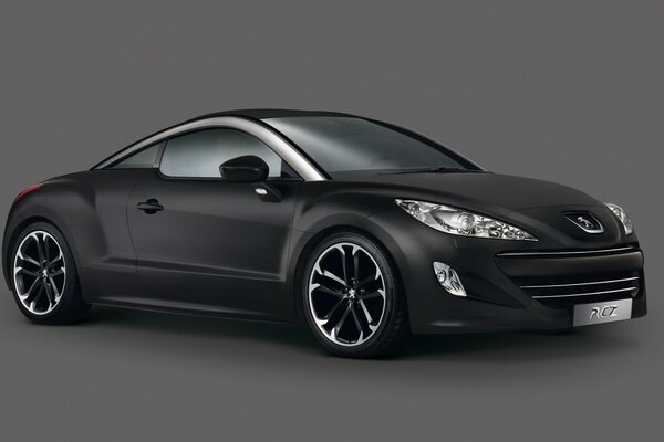 Black Peugeot on a grey background