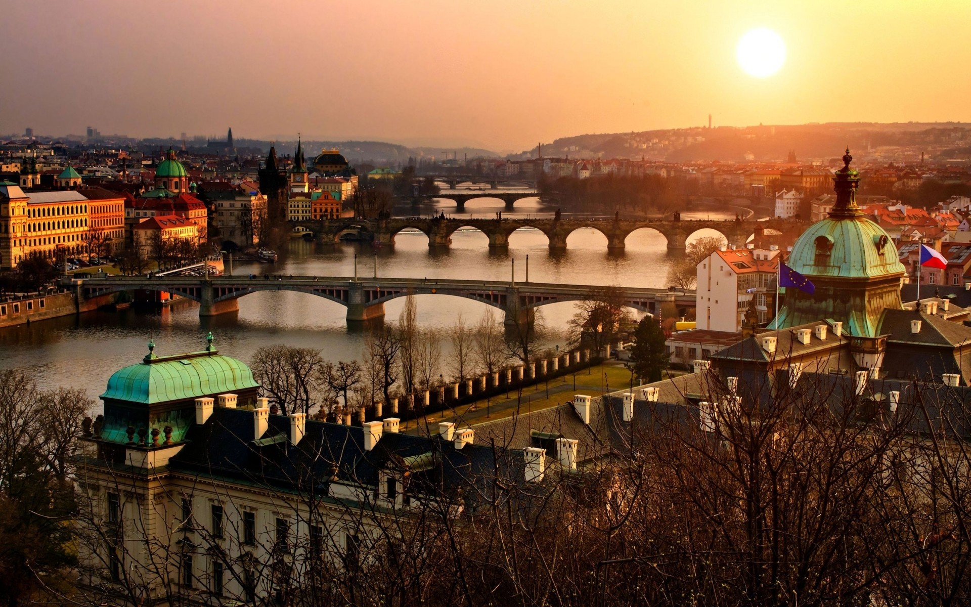 other city city travel sunset architecture evening dawn bridge building cityscape dusk river water outdoors house church town old city view sun