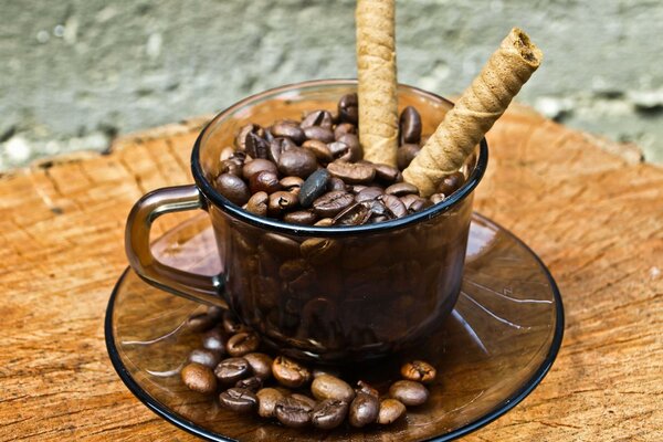 Coffee beans in a transparent mug