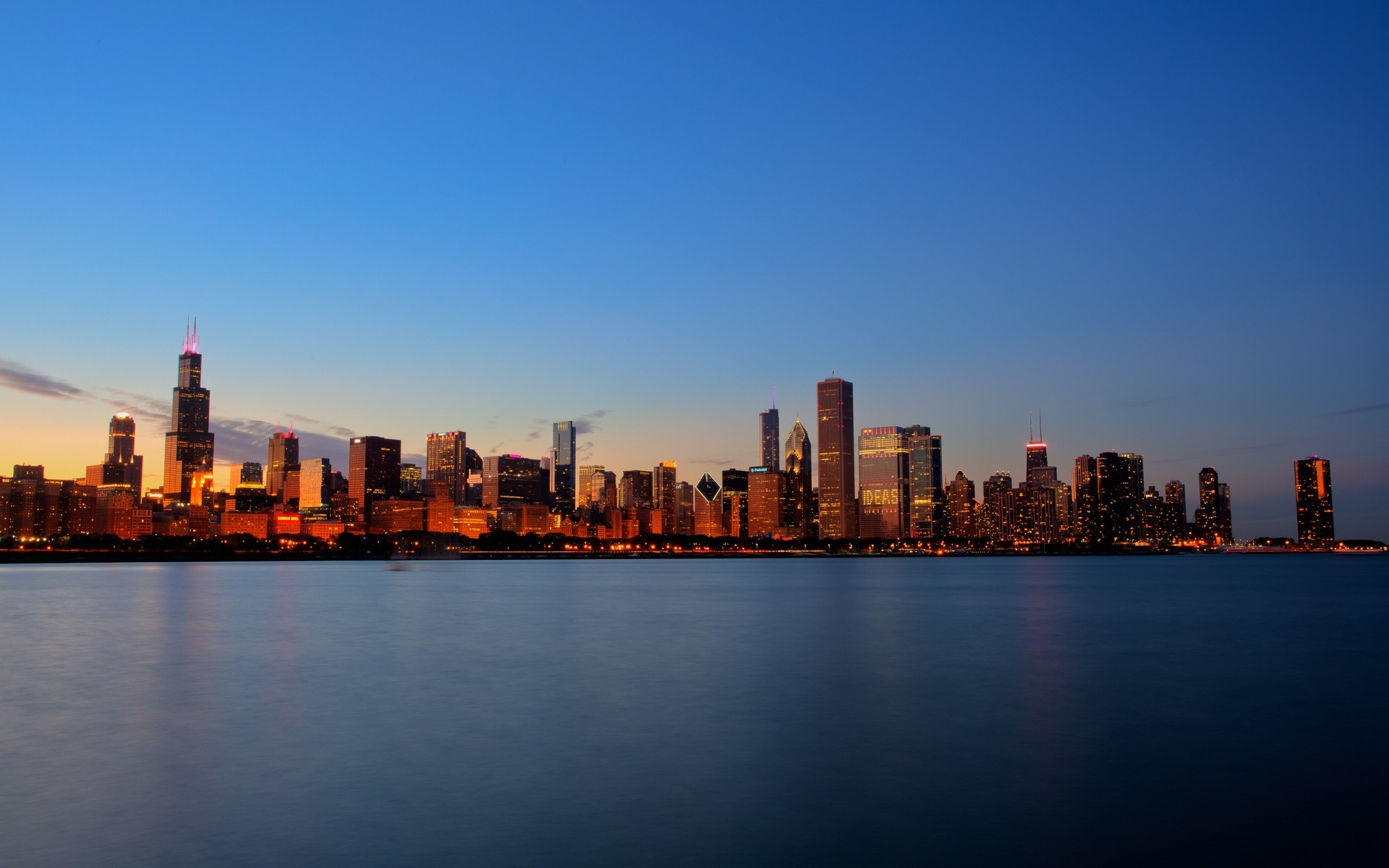 united states downtown architecture city skyline dusk sunset cityscape water skyscraper river sky reflection business building office travel evening waterfront