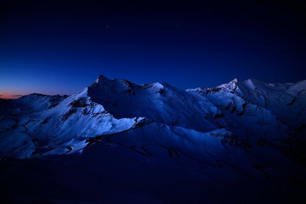 Snowy mountain peak in the dark