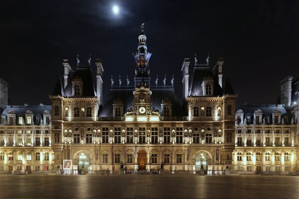 An old castle on the town square in the night city