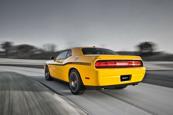 Yellow car drift on asphalt