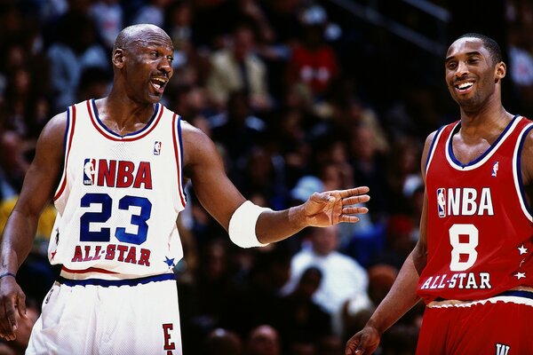 Two black blacks play basketball against each other in the NBA