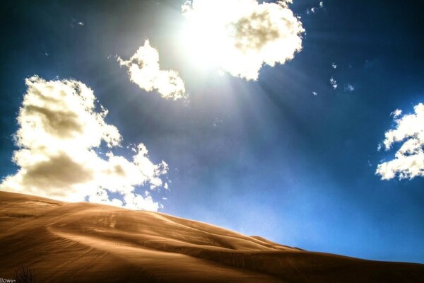 Sunny sky in the desert with clouds