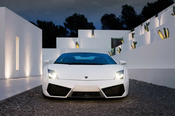 White lamborghini on a background of white walls