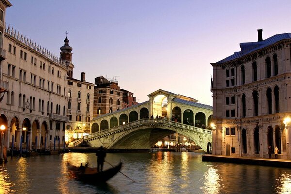 Venetian canals with bridges and boats