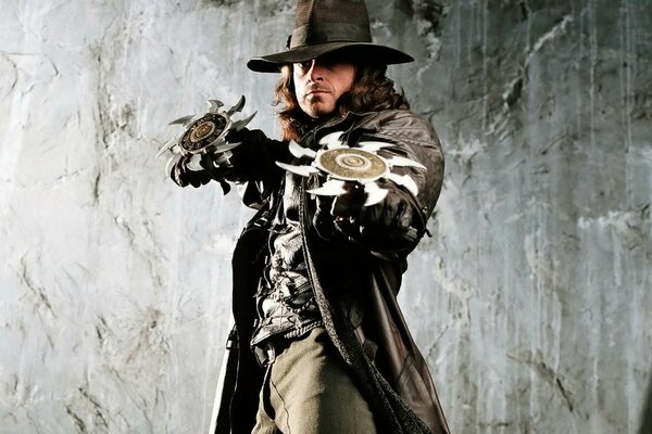 A vampire hunter with an asterisk weapon in his hands