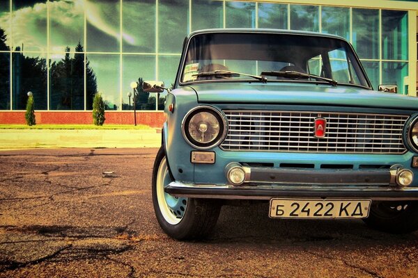 Retro car on the background of a building