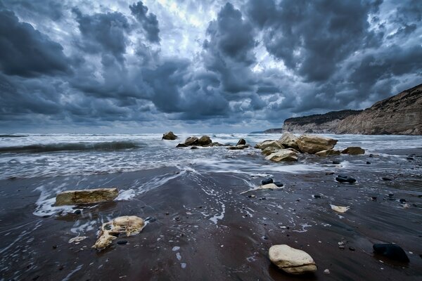 Cold gloomy view of the surf in heavy clouds on the horizon