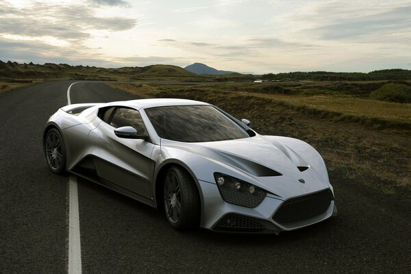 Silver car on the evening highway