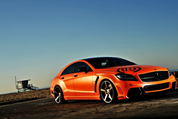 Red Mercedes on a blue sky background