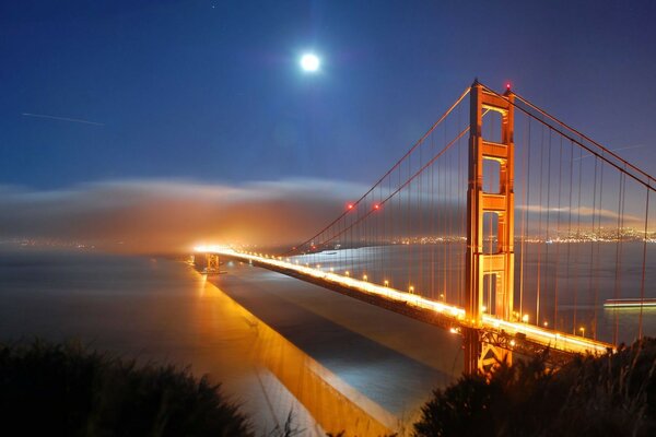 Bridge in the water at sunset