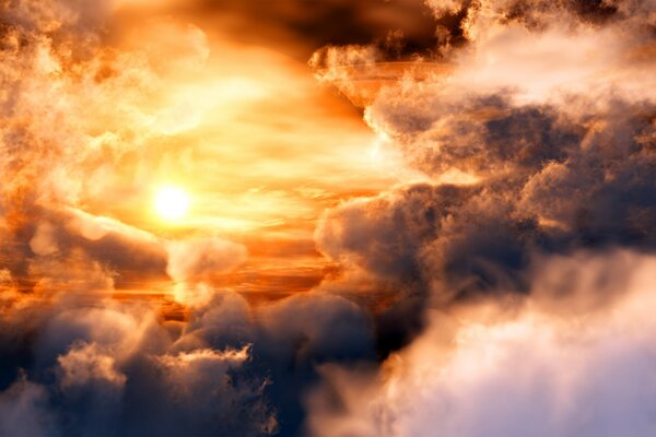 Rain cumulus clouds at sunset