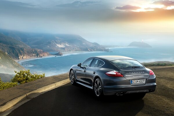 The gray Porsche stopped at the cliff