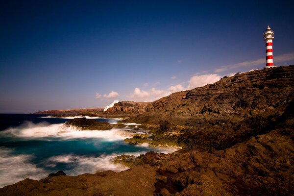 Beautiful lighthouse on the hillside