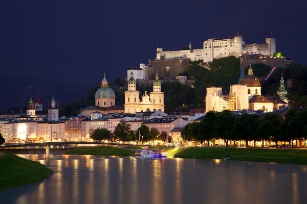 Majestic castle by the water in the sunset