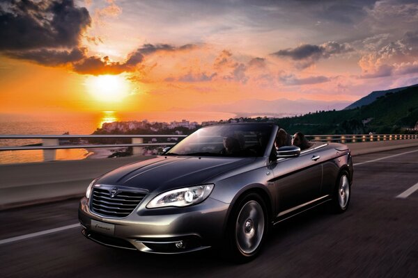 Beautiful car on sunset background