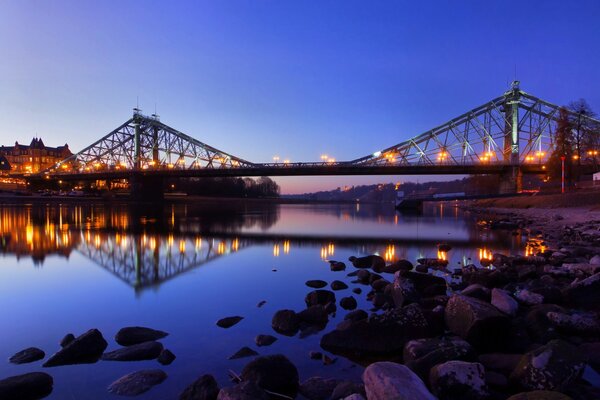 The bridge is reflected in the water