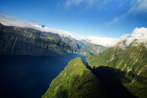 Mountains against the background of the river and the blue sky