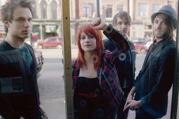 A girl with fiery hair on the street